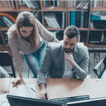 people going over data in computer